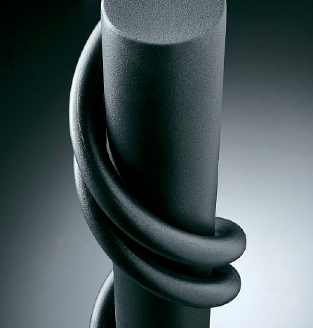 Top detail of Londra vertical free standing radiator by Brandoni Italy with twisting tubes in graphite grey