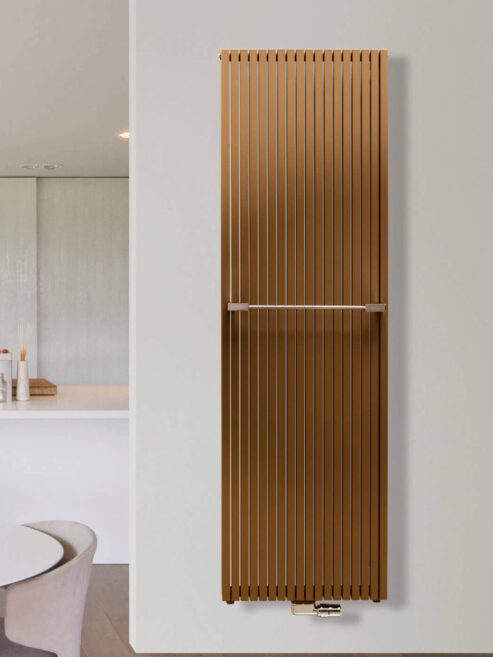 Square Tube Carre Vertical Radiator in Orange Brown by Vasco shown in kitchen with additional towel bar