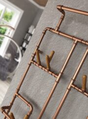 Detail of Pajak Electrci Towel Rail made from copper pipe and wooden towel pegs