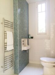 Polished Stainless Steel Sudbrook Towel Rail in bathroom