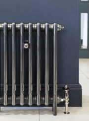 Mercury 3 Column radiator in Mirror Polish on tiled floor and blue wall