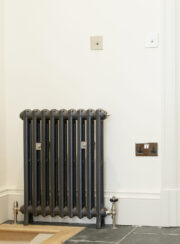 Traditional Spartan 2 Column Cast Iron Radiator finished in Astral Grey with satin nickel valves and retaining stays