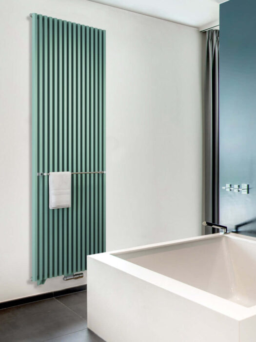 Zana Radiator in Jade Green shown in bathroom