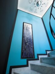 Greenor Amadhy in Blue on blue stairs