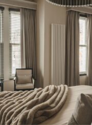 Cream Arianna Vertical radiator in bedroom