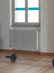 White Ekos Aluminum Traditional style radiator finished in RAL9010 in the gym