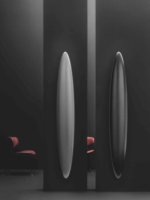 Matt Black Surf Electric surfboard radiator shown in Front room