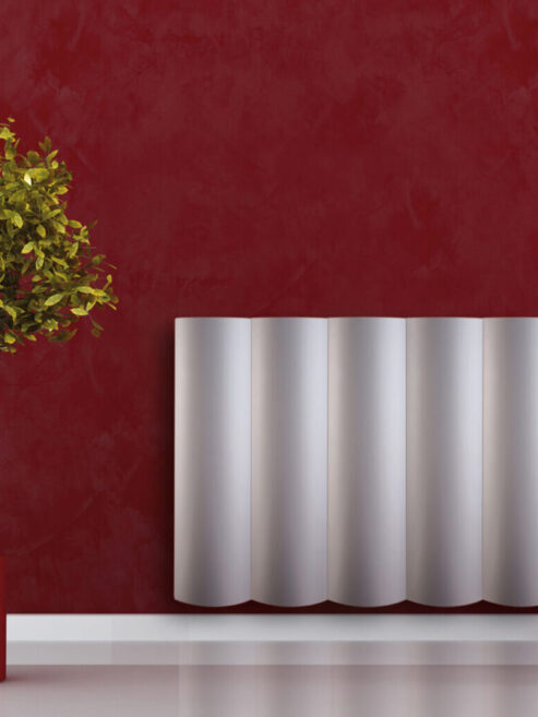 Margaroli Tonda Aluminium Wavy fronted Radiator in red living room
