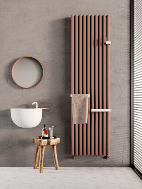 Arianna with Arys towel rail and hook shown in a bathroom finished in sandstone