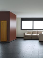 Horseshoe Round Vertical Radiator in Yellow in Living Space
