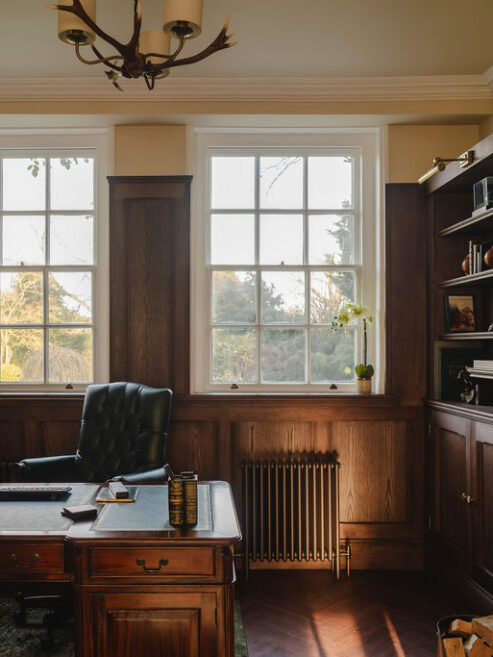 Traditional radiator shown in office in Victorian home