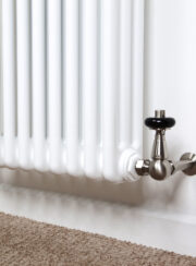 Detail of RadCen TRV Corner valve on white column radiator