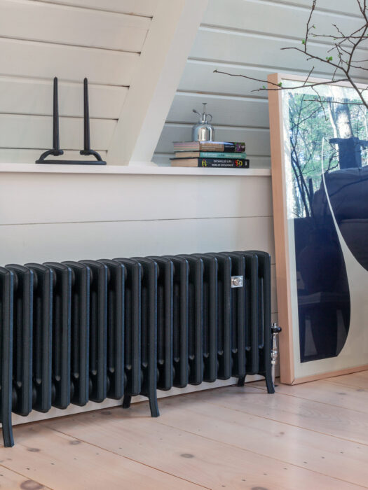 Spartan 4 Column cast iron radiator in bedroom finished in Black Iron