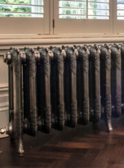 Hand Polished Rococo III Cast Iron Radiator on wooden parquet flooring