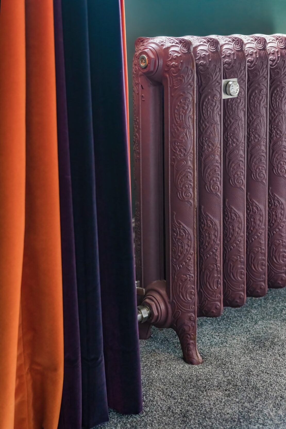 Cast Iron Rococo II radiator finished in Lilac with curtains