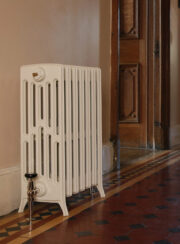 Spartan 6 Column cast iron traditional radiator on tiled hall way in chalk white finish
