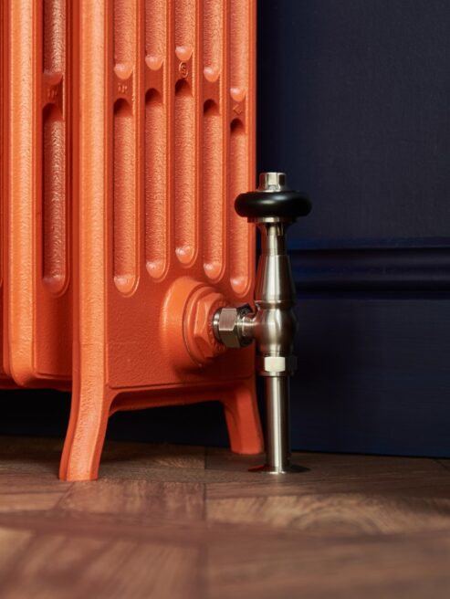 Spartan 6 Column cast iron radiator in Fireball Orange with retaining stay leg section detail