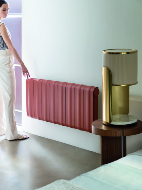 Agora Designer Aluminium Radiator in Copper Brown in Living Room with light