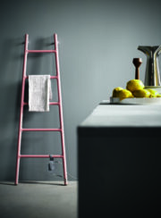 Pink Wall Mounted Scaletta Towel Rail in White in bathroom