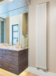 RT25 Single Vertical Tube designer radiator in white with underneath chrome TRV corner valves finsihed in white