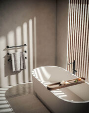 Margaroli Sereno 521G in Matt Black Brushed Nickel with knurled bars in bathroom with white standalone bath