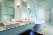 Lucy Towel Rail from Cordivari in Milky finish in white bathroom suite with wooded flooring