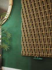 Willow Designer Radiator Detail Terma in Brass on green painted wall