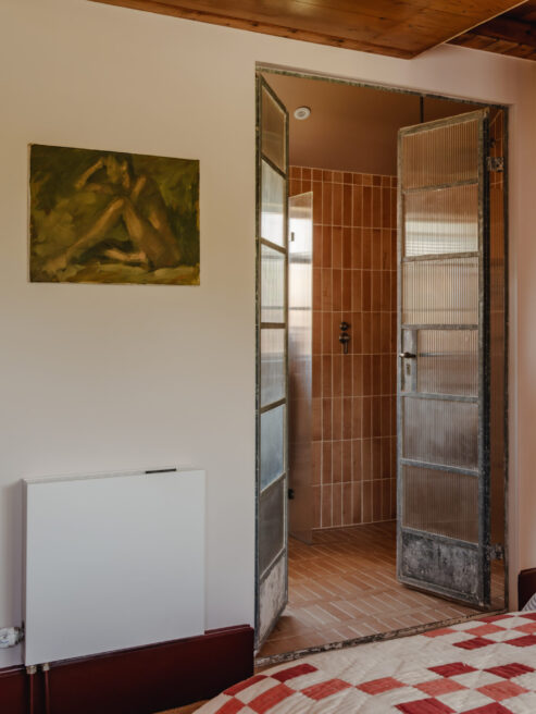 White Strada Fan Assisted Efficiency Radiator by Master Bedroom Ensuite for heat pump with light cooling