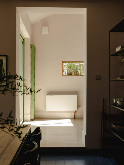 Jaga fan assisted heat pump Efficiency Radiator in Kitchen with sunlight and green ladder