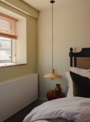 Strada Efficiency Radiator in Master Bedroom with hanging light and wooden blind