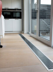 Micro Canal Trench Heating Installation in Kitchen by patio Doors and wooden floor