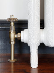 Abbey Traditional TRV Thermostatic Valve Set in Natural Brass on White Cast Iron Ornate radiator