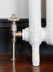 Abbey Traditional TRV Angle Valve in Satin Nickel on white ornate cast iron radiator