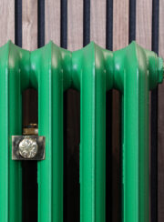Emmeline III Traditional Cast Iron Radiator Front Profile in Green and wood panelling